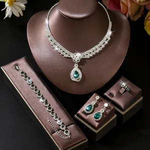 Detailed shot of vintage palace style green teardrop rhinestone jewelry set necklace.