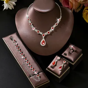 Exquisite red crystal jewelry set detail view, featuring sparkling rhinestones on display.