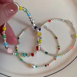 Silver bead rainbow smiley charm bracelet set, sweet and trendy stacking jewelry for women.