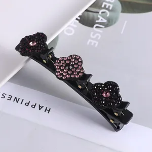 Dubbele strass haarspeld met zwarte en roze kristallen bloemen voor elegante kapsels.