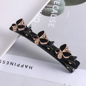 Zwarte dubbele haarspeld met gouden vlinder strass details voor elegante vrouwen styling