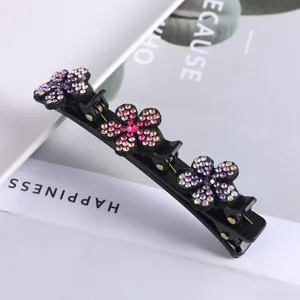 Dubbellaagse haarspeld met strass bloemen, zwarte eendebek haarklem voor styling en vlechten.
