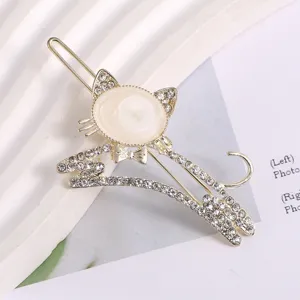 Gold rhinestone cat hair clip detail shot, elegant crystal rhinestone hair accessory style.