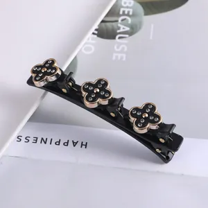 Zwarte meerlagen haarspeld met strass klaverblad ontwerp, elegante haarstyling hulpmiddel.
