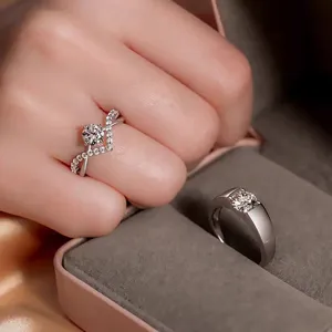 Moissanite diamond couple rings set, crossover engagement ring and classic wedding band.