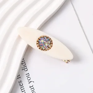 Exquisite resin duckbill hair clip detail showing the sparkling iridescent rhinestone center.