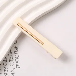 Minimalist resin hair clip with gold stripe, elegant duckbill clip for daily styling.