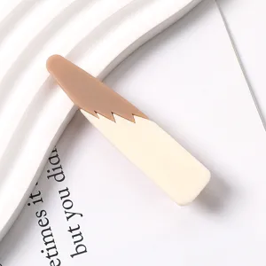 Detailed close-up view of a stylish color-block resin duckbill hair clip in brown and beige.