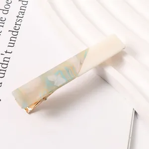 Close-up detail of geometric color-blocked resin duckbill hair clip, chic daily styling.