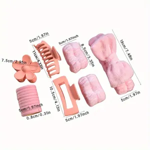 Set d'accessoires de coiffure rose avec chouchous en peluche et pinces pour un look élégant.