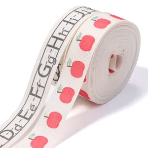 Cotton ribbon featuring cute apple and alphabet patterns, perfect for DIY gift wrapping and decor.
