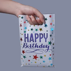 Colorful birthday gift bag detail showing star patterns and portable handle design for party candy.