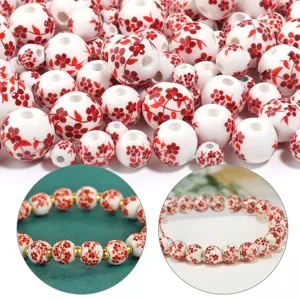 Perline di ceramica in stile cinese con motivi floreali rossi per braccialetti e collane fai da te.