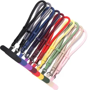 Dragonne de poignet tressée colorée pour téléphone avec boucle en métal et languette.