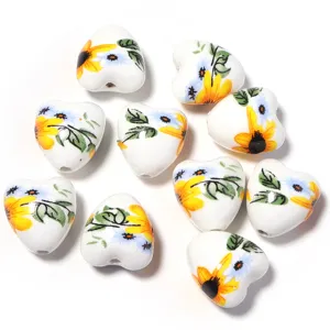 Perles en ceramique en forme de coeur avec motif tournesol pour fabrication de bijoux DIY.