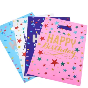 Colorful birthday gift bags with stars and confetti patterns, perfect for party favors.