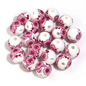 Perline in ceramica con motivo floreale rosa, perle rotonde sfuse per creazione gioielli fai da te.