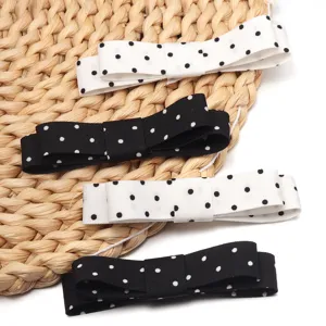 Pinzas de pelo con lazo de lunares, accesorios de cabello de doble capa en negro y blanco.
