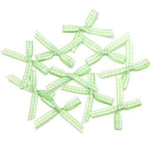 Fiocchi in nastro a quadretti verde e bianco, perfetti per fai-da-te e dettagli di confezione.