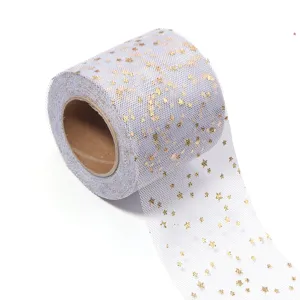 Close-up detail of white tulle ribbon roll featuring sparkling gold stars for DIY crafts.