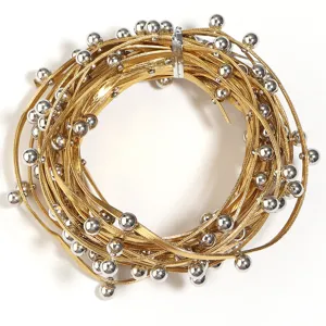 Gold cord necklace trim with silver beads detail, punk style fashion accessory material.