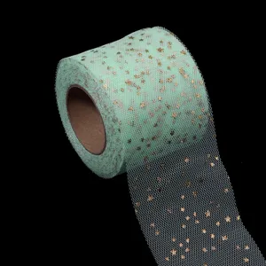 Mint green tulle roll with gold stars, perfect for DIY crafts, wedding decor and party wrapping.