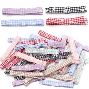 Polyester floral plaid bow hair clip accessories for DIY crafts and hair styling.