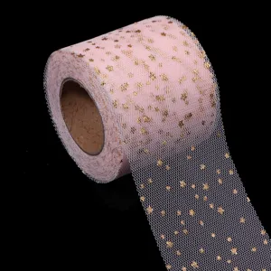 Pink tulle roll with gold foil stars for DIY crafts, wedding dresses, and party decorations.