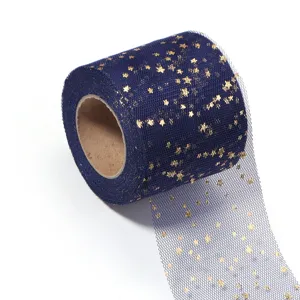 Navy blue tulle fabric roll detail, gold star print mesh ribbon, craft DIY material.