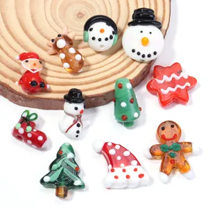 Close-up of handmade Christmas glass beads, colorful holiday charms for DIY jewelry.