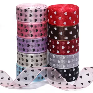 Rotoli di nastro trasparente stampato a cuore colorato per fai da te, confezioni regalo.
