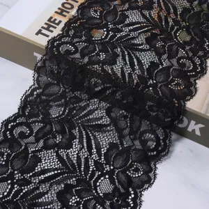 Black stretch lace trim fabric for sewing clothing cuffs, skirts, and DIY hair accessories.
