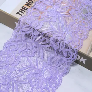 Purple stretch lace trim detail, delicate floral pattern fabric for sewing DIY crafts.