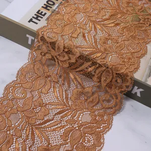 Wide elastic lace trim detail shot, bronze floral fabric for garment sewing and DIY crafts.