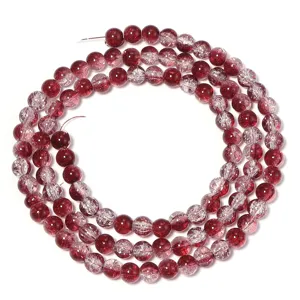 Detailed view of red cracked glass beads for DIY jewelry making, bracelets, and necklaces.