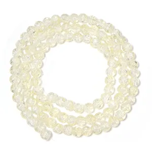 Yellow cracked glass beads detail closeup for DIY handmade jewelry bracelets necklaces crafting.