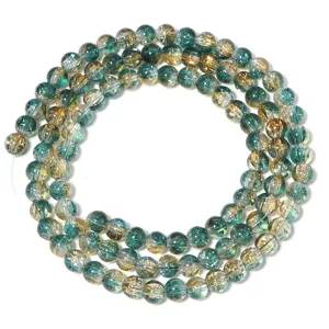 Close-up detail of iridescent two-color glass cracked-flower round beads for DIY jewelry making.