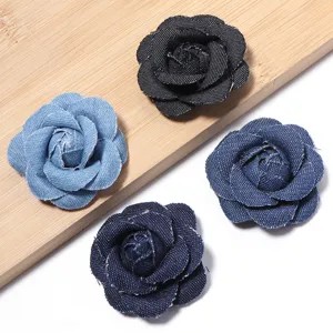 Detailed close-up view of four assorted denim rose flower accessories in various colors.
