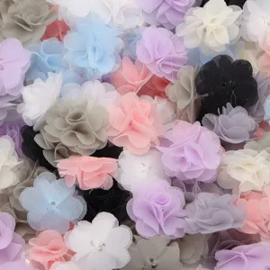 Close-up detail shot of colorful chiffon 3d flower appliques, soft fabric texture for DIY.