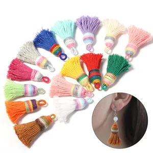 Close-up view of vibrant handmade cotton tassel charms, perfect for DIY jewelry and earring design.