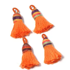 Detailed view of short chunky silk tassels with loops for DIY jewelry and bag charms.