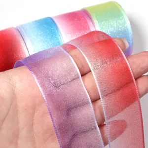 Detailed view of colorful gradient sheer organza ribbon, perfect for gift wrapping and DIY crafts.