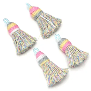 Details of colorful gradient cotton tassels, short fluffy shiny thread charms for DIY jewelry.