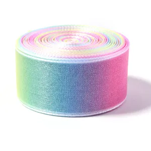 Close-up detail of a vibrant rainbow gradient sheer ribbon roll, perfect for crafts and gifts.