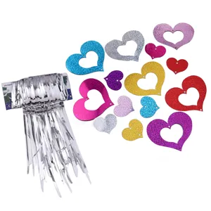 Silver tinsel foil fringe curtain with glitter hollow heart pendants for party wedding decor.