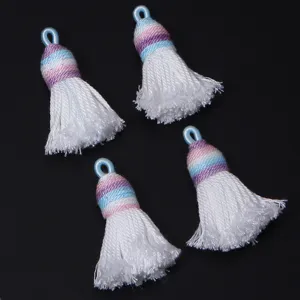 Detail shot of gradient short shiny silk cotton thread tassels for DIY handmade crafts and jewelry making.