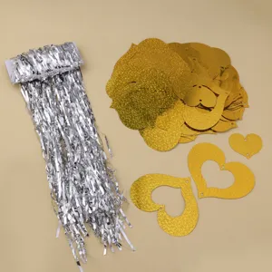 Silver fringe tinsel and gold holographic hollow heart pendants for wedding party decor details.