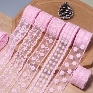 Pink lace trim detail, floral embroidery mesh ribbon roll for DIY crafts, sewing, and garments.
