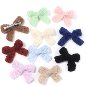 Colorful knitted wool bow hair clips set, detailed close-up view of fuzzy hairpins.