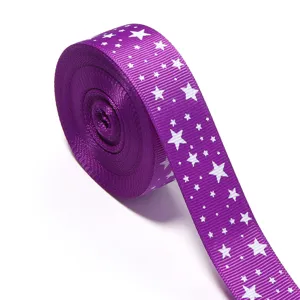 Cinta grosgrain purpura con estrellas blancas, ideal para manualidades y decoracion.
